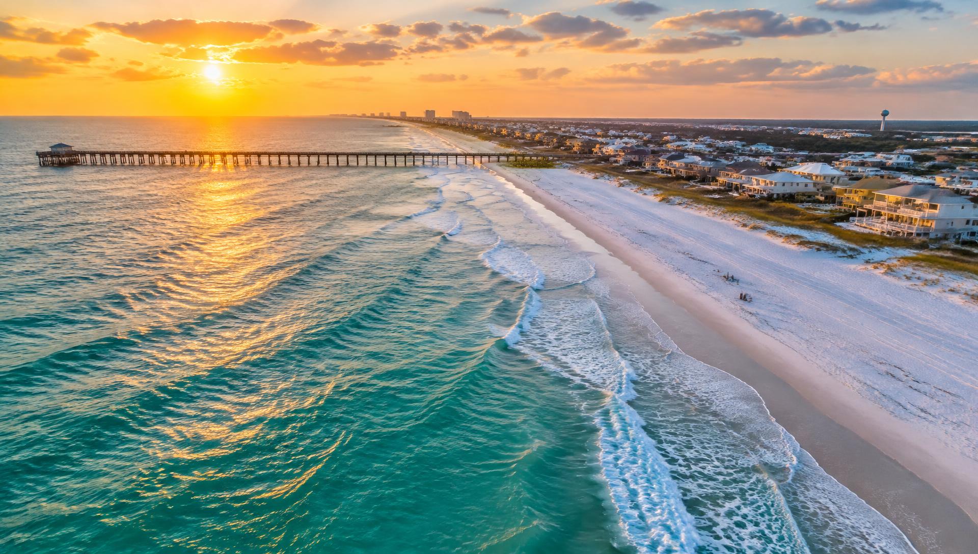 Aerial view of the Gulf Coast shoreline at sunset